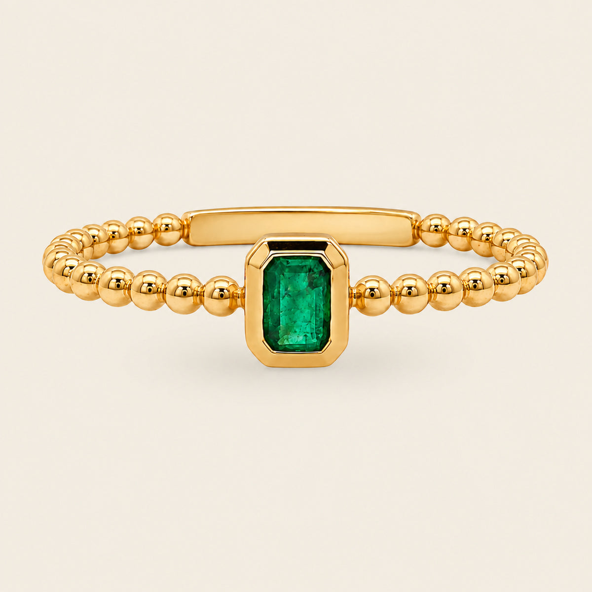 Clara – Anillo Bezel de Oro Amarillo 14k con Esmeralda Corte Esmeralda