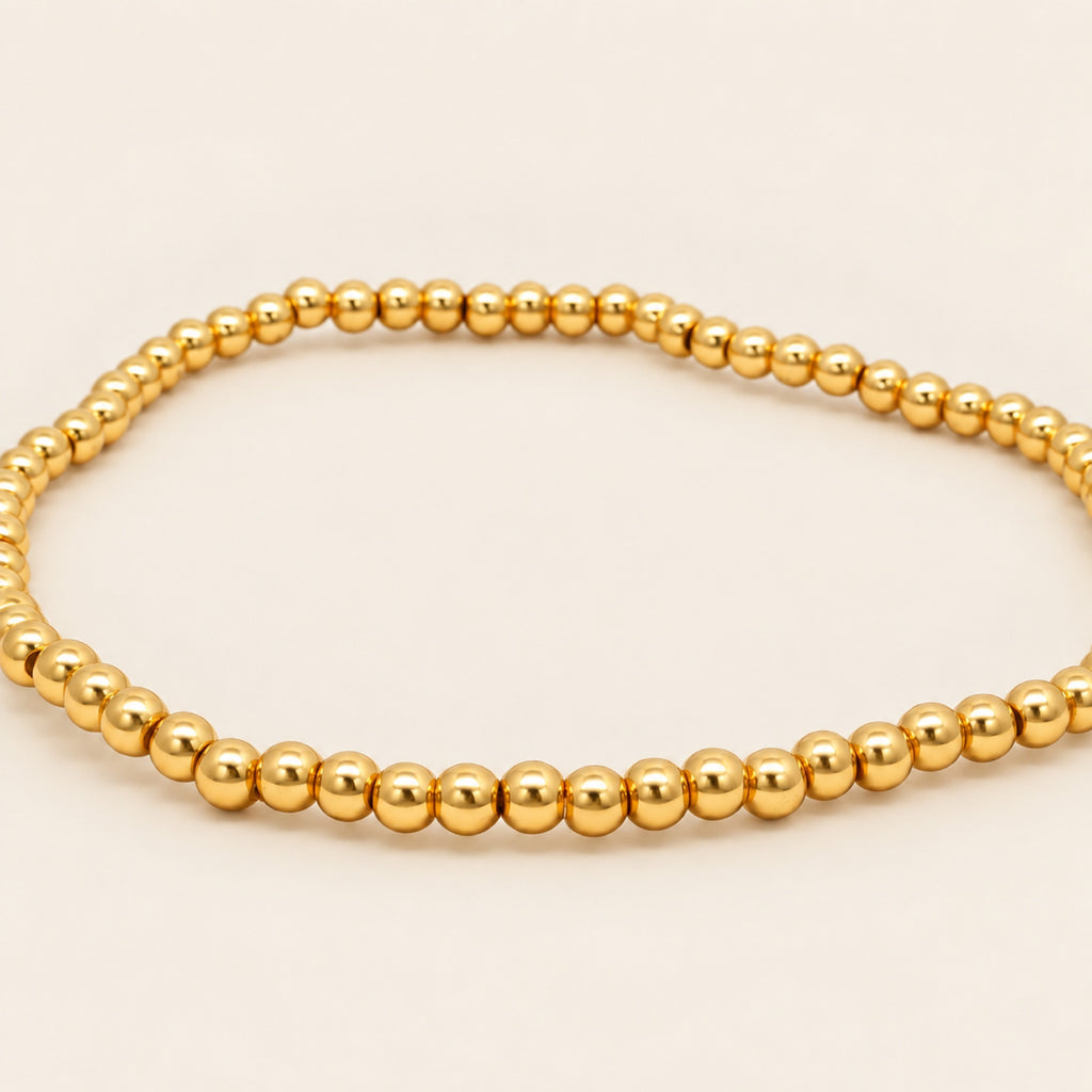 Pulsera Elástica de Oro Laminado con Esferas y Barra