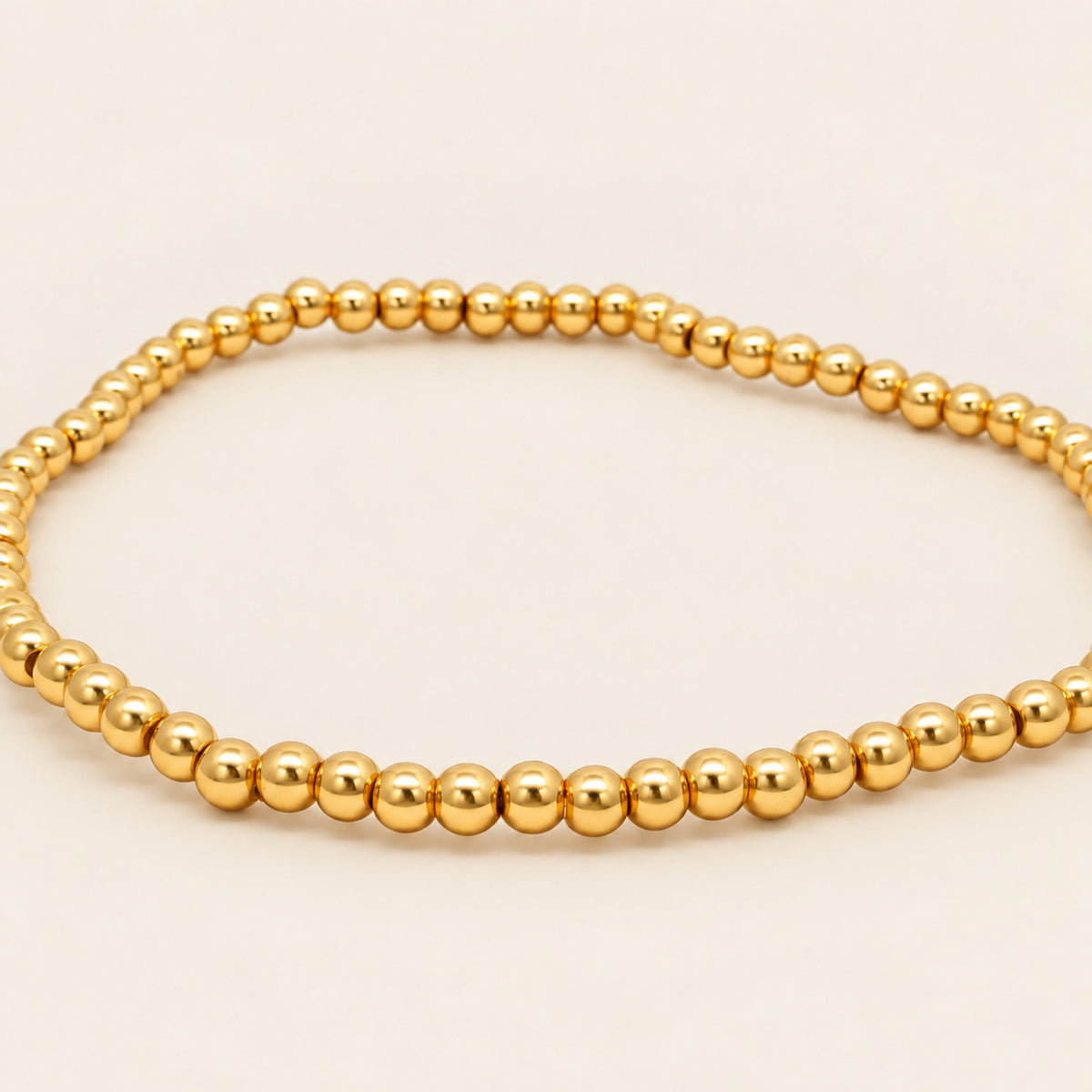 Pulsera Elástica de Oro Laminado con Esferas y Barra