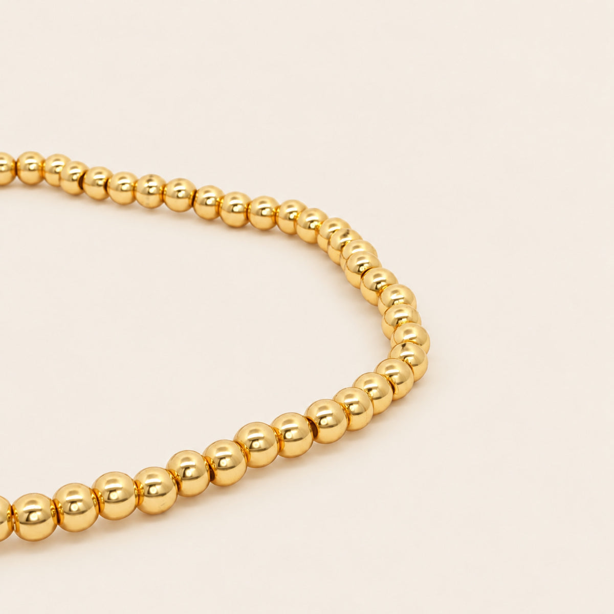 Pulsera Elástica de Oro Laminado con Esferas y Barra