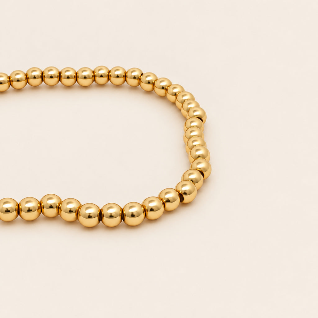 Pulsera Elástica de Oro Laminado con Esferas Pequeñas