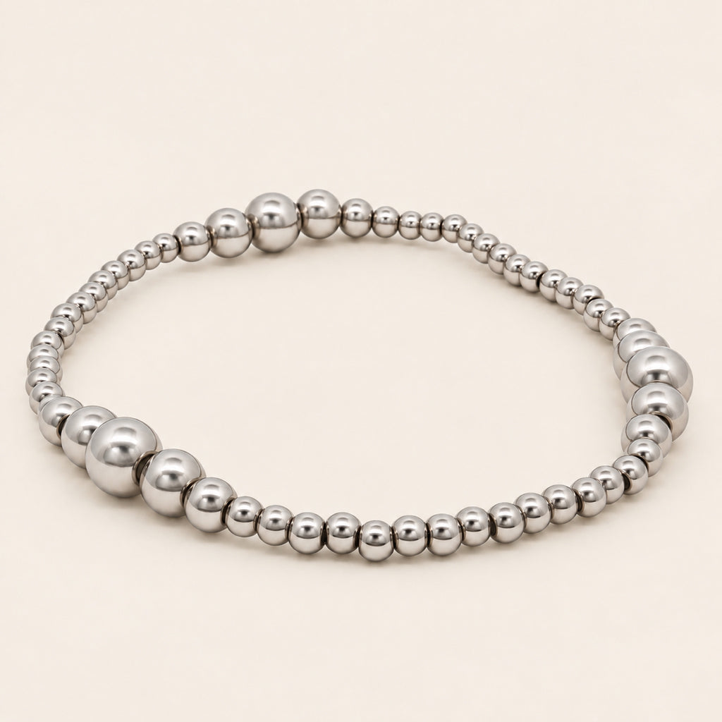 Pulsera Elástica de Oro Laminado Plateado con Esferas Graduales