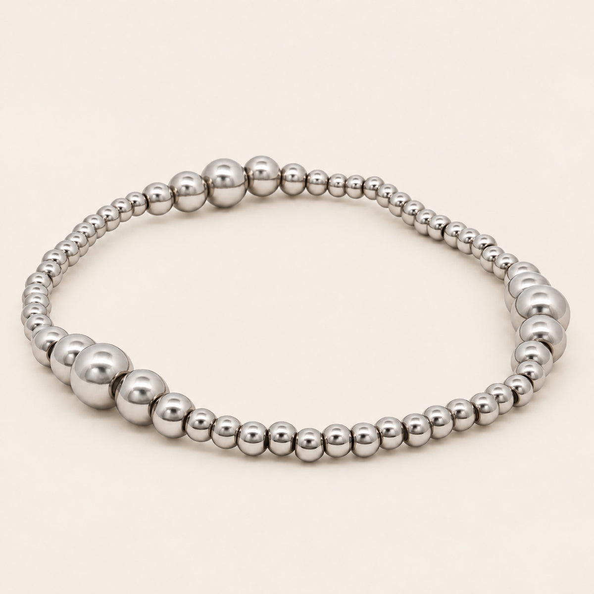 Pulsera Elástica de Oro Laminado Plateado con Esferas Graduales