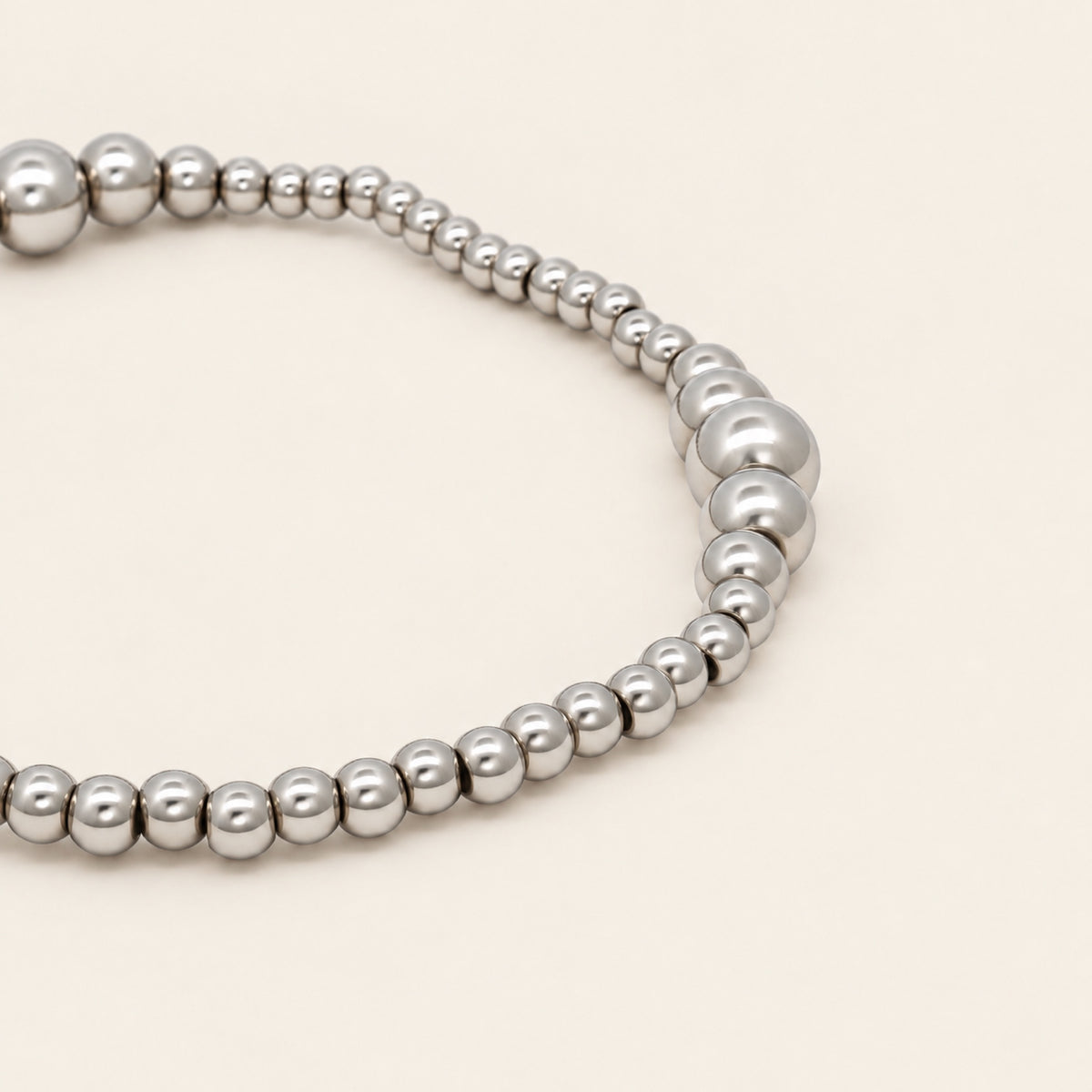 Pulsera Elástica de Oro Laminado Plateado con Esferas Graduales