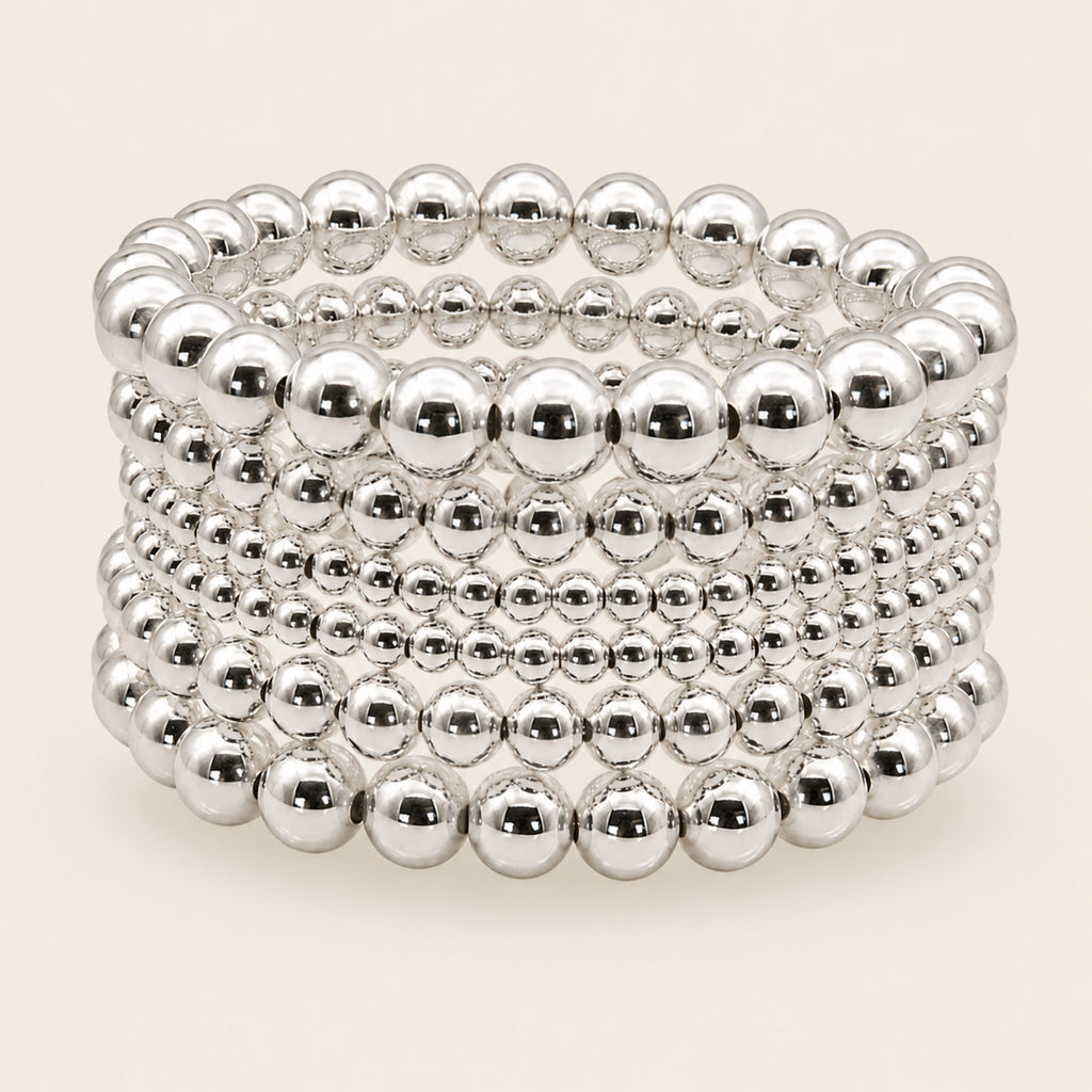 Pulsera Elástica de Oro Laminado Plateado con Esferas de Seis Vueltas
