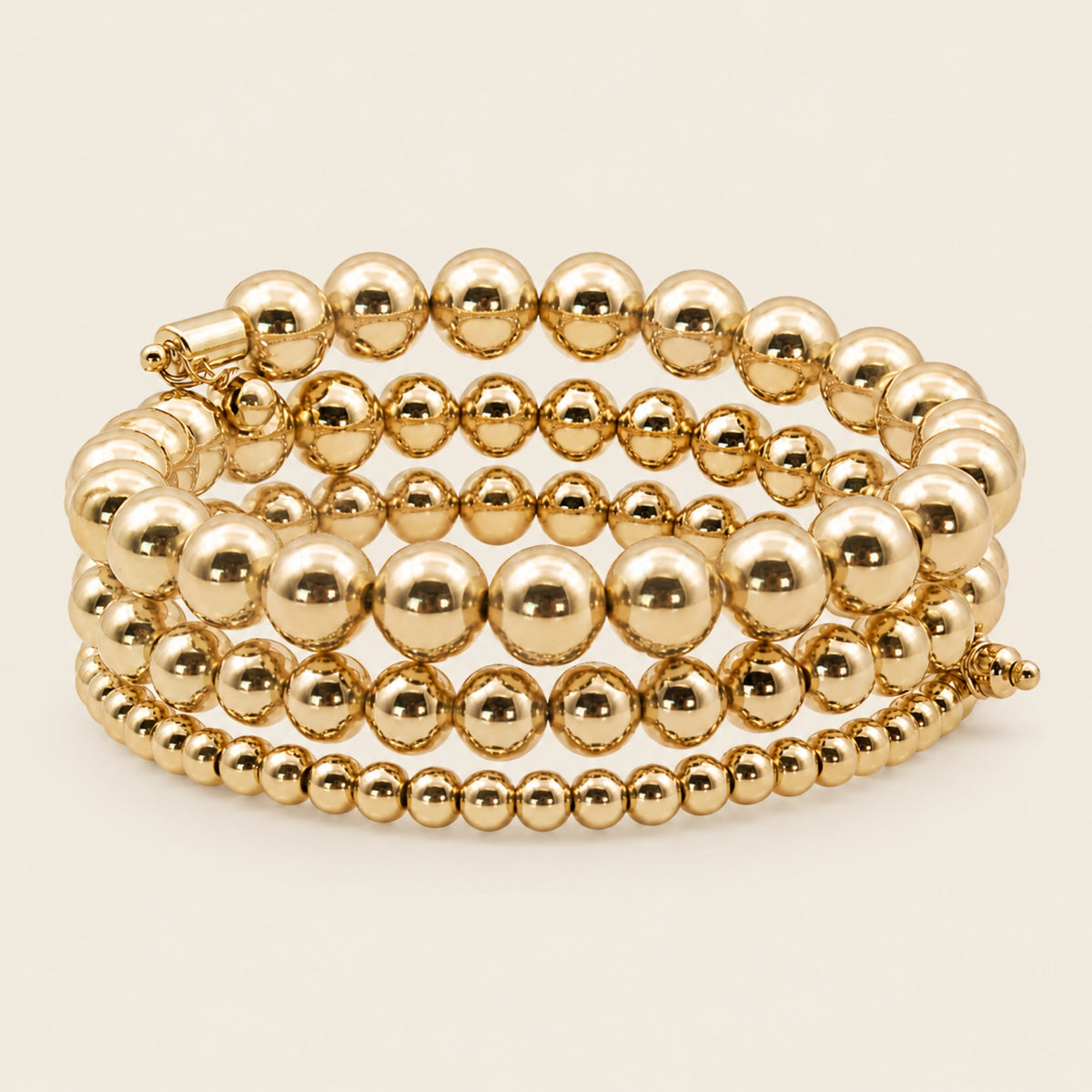 Pulsera Espiral de Oro Laminado con Esferas de Cuatro Vueltas