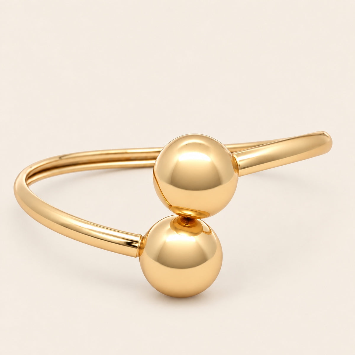 Pulsera Rígida de Oro Laminado con Dos Esferas