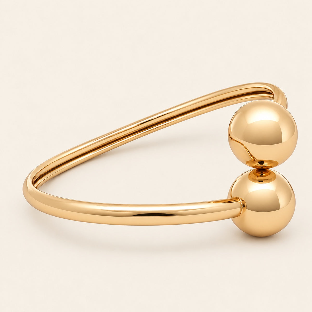 Pulsera Rígida de Oro Laminado con Dos Esferas