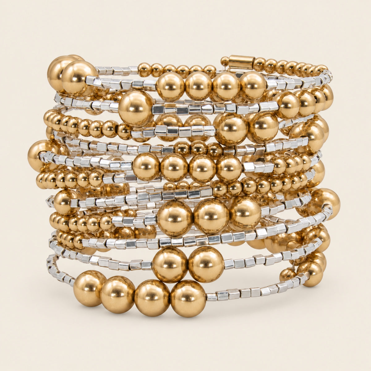 Pulsera Espiral de Oro Laminado con Esferas y Detalles Plateados