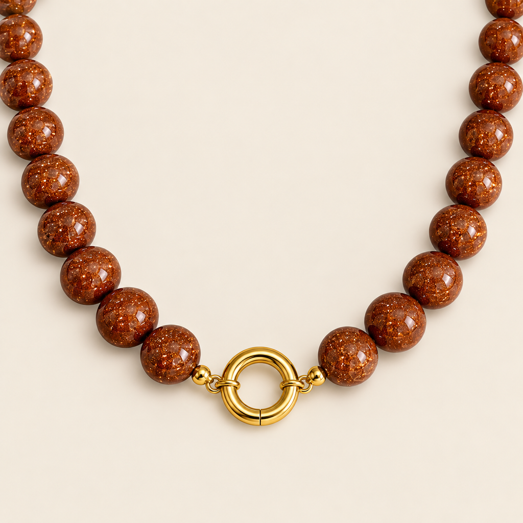 Estrellas – Collar Dorado con Goldstone Café