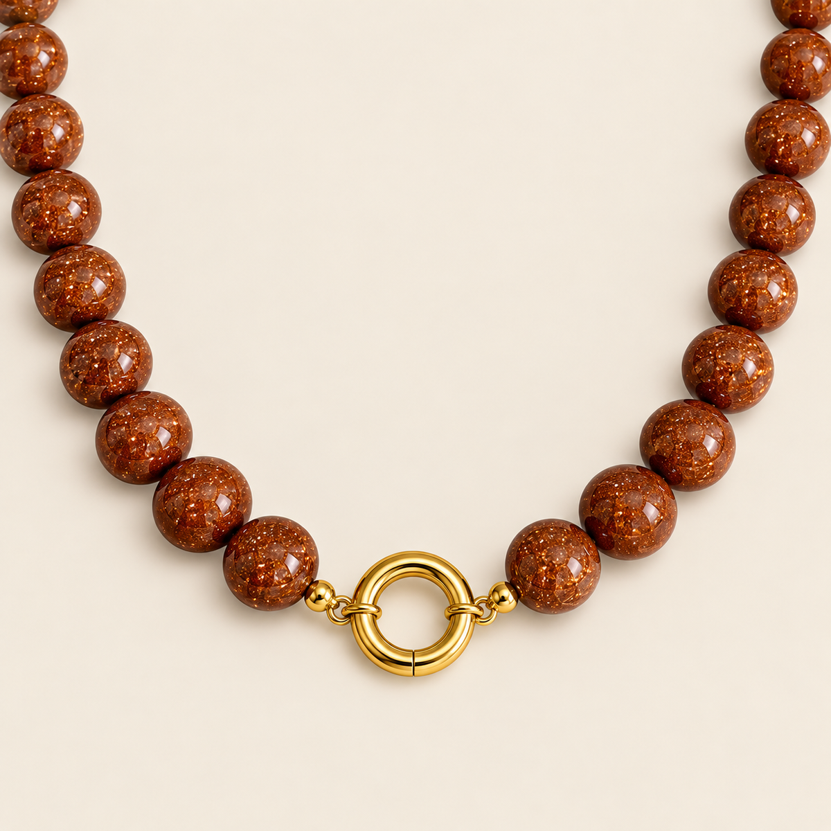 Estrellas – Collar Dorado con Goldstone Café