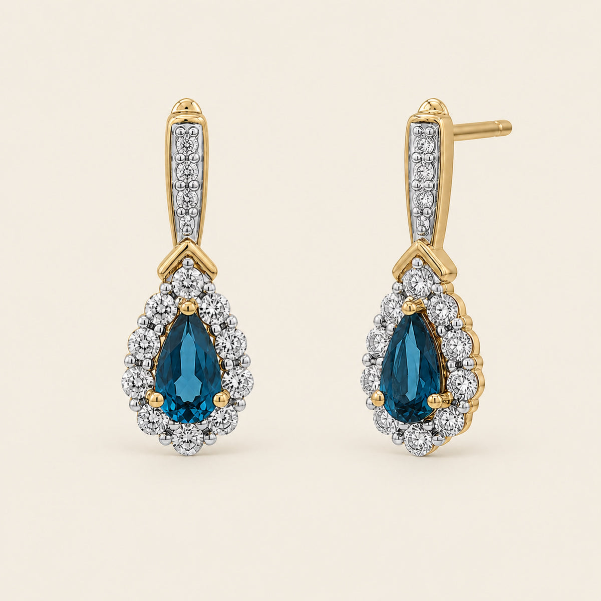 Abril – Aretes de Oro Amarillo 14k con Topacio Azul y Diamante