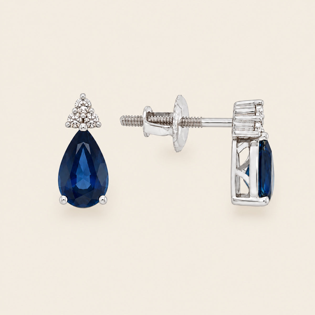 Aretes de Oro Blanco 14k con Zafiro Pera y Trío de Diamantes